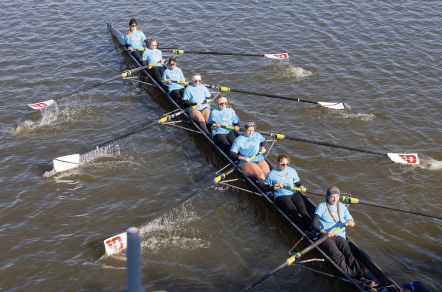 Marquette's women's eight at full pressure during a race, seen from above.