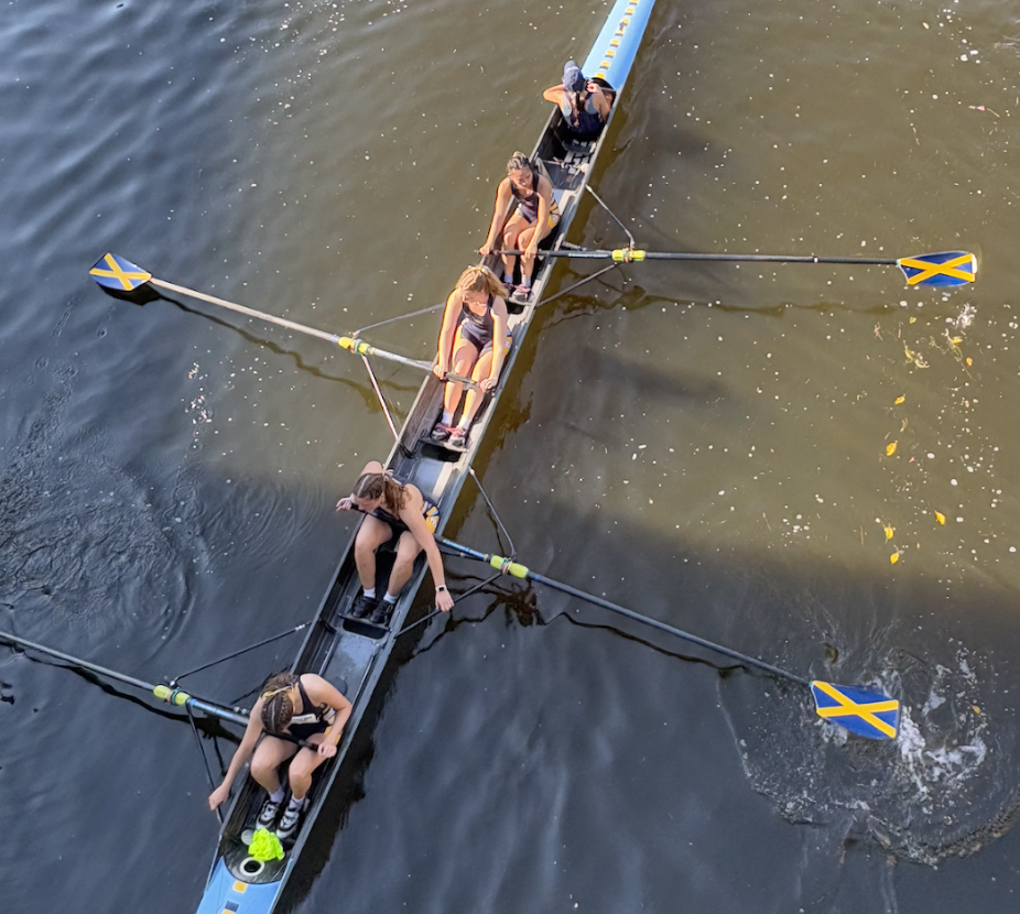 Marquette's women's eight at full pressure during a race, seen from above.