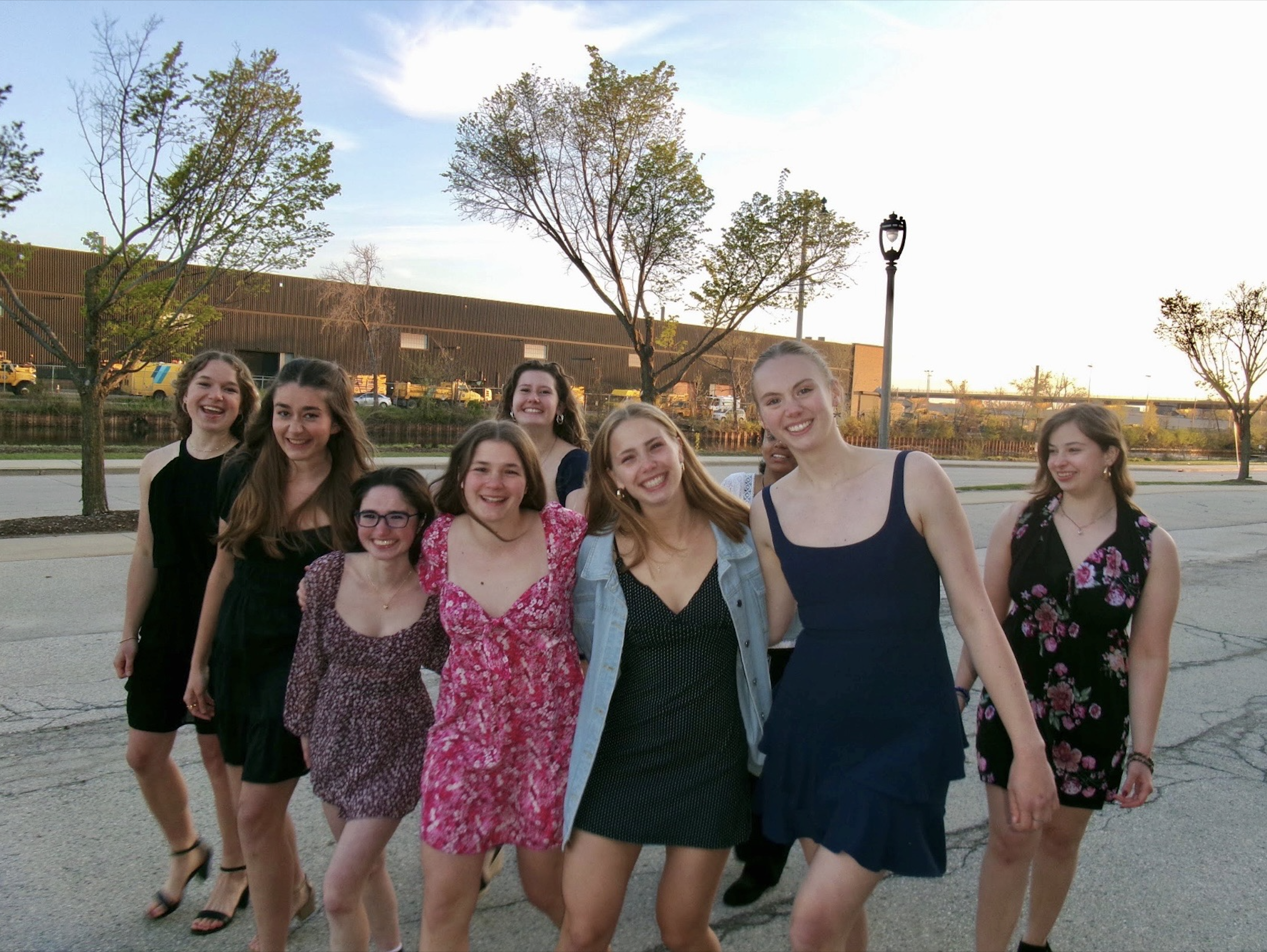The full Marquette Crew team gathered around the boat trailer after a spring race.